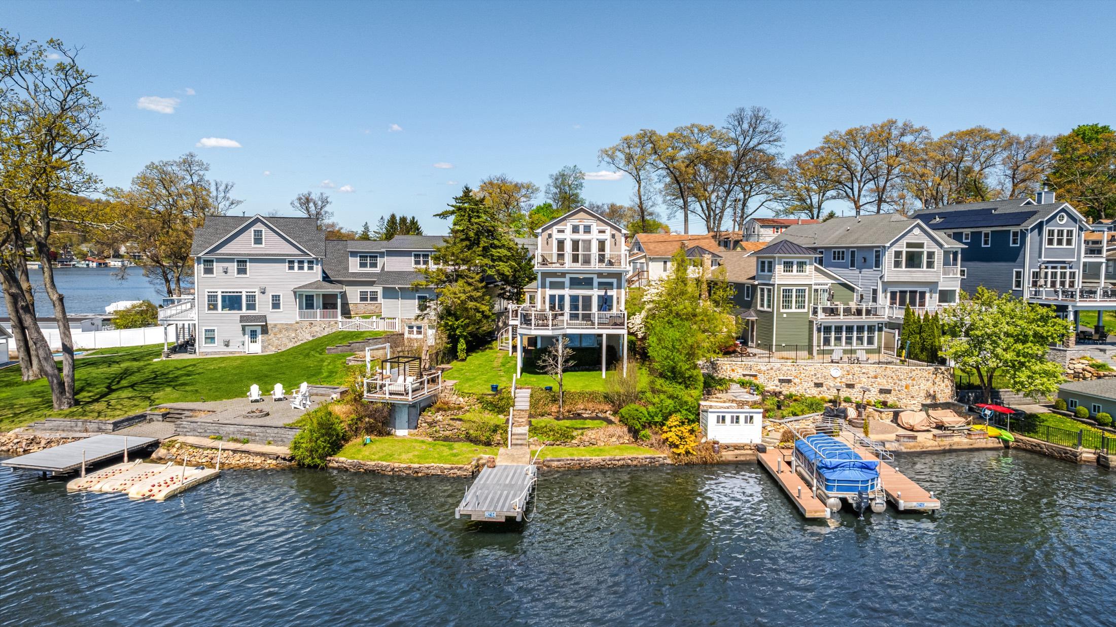Stone and siding home exterior with manicured landscaping