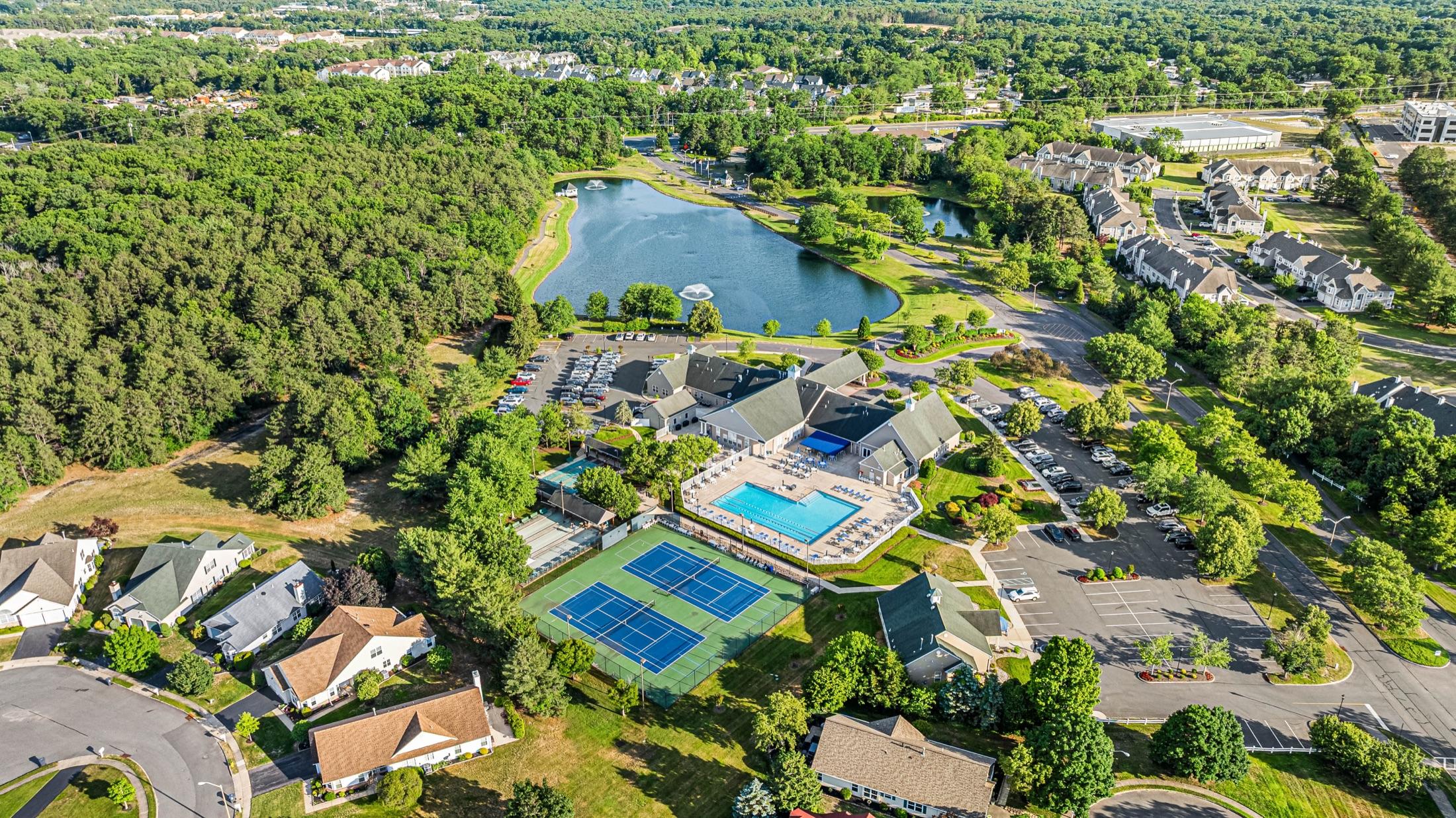 Aerial drone view of a home and wooded property, NJ