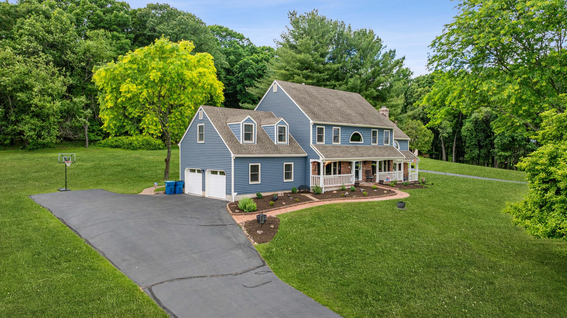 Aerial drone photograph of a property and surrounding land