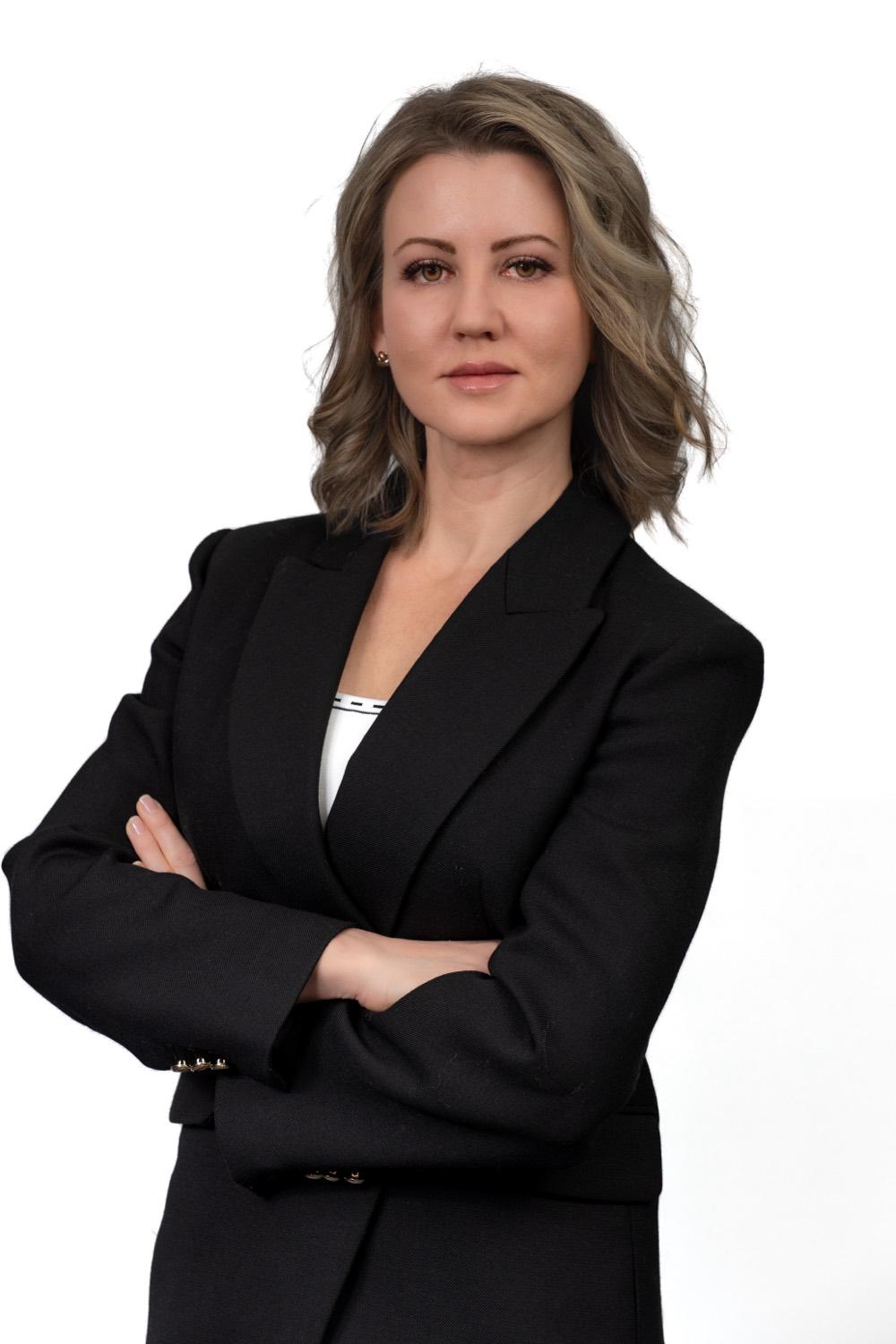Professional headshot of a woman in a blazer