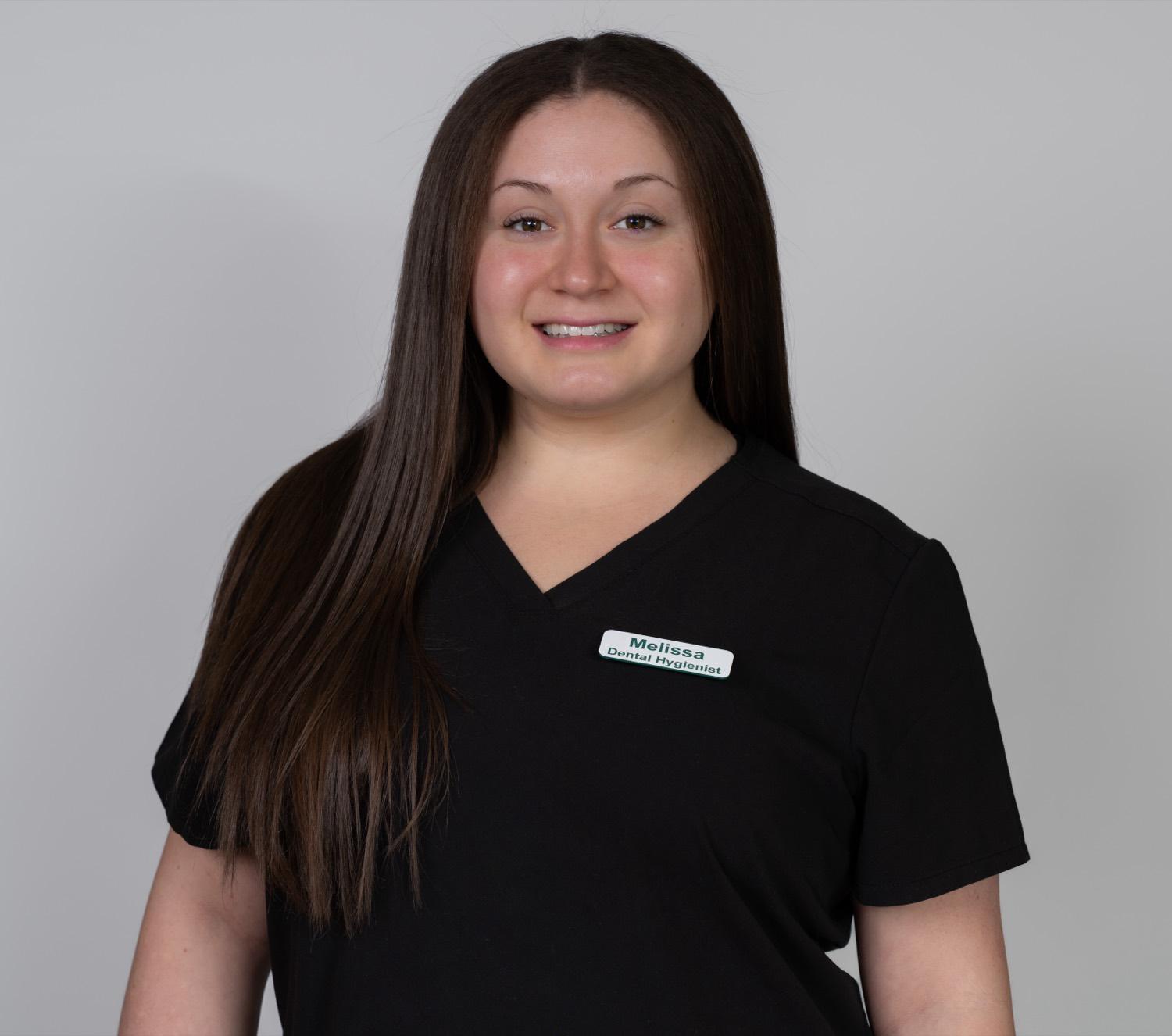 Professional headshot of a dental hygienist