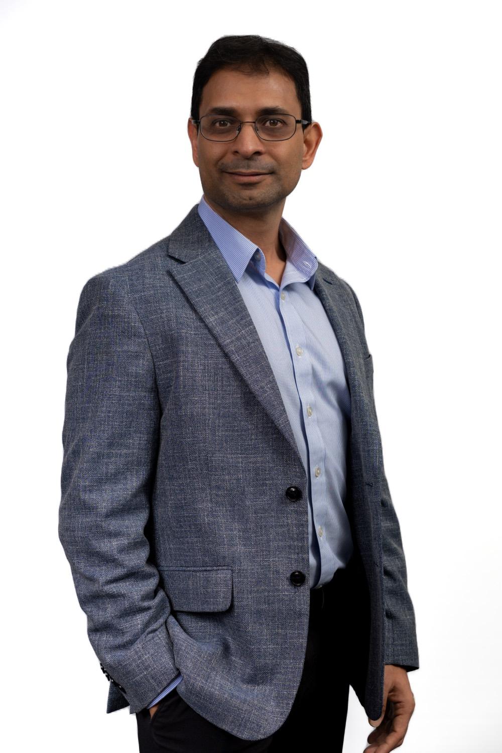 Professional corporate headshot of a man
