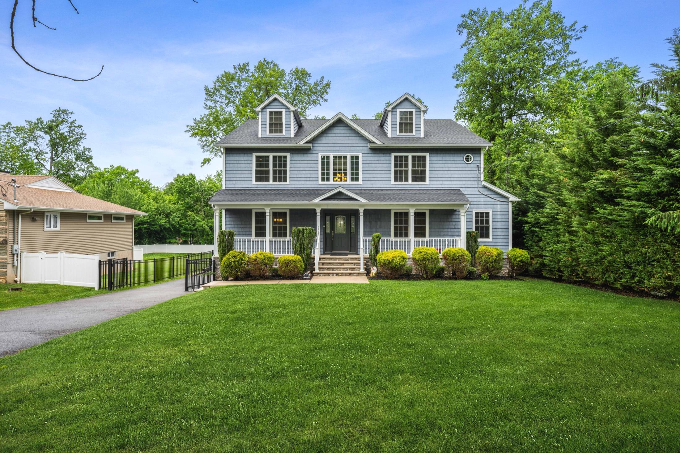Front exterior of a classic New Jersey colonial home in daylight