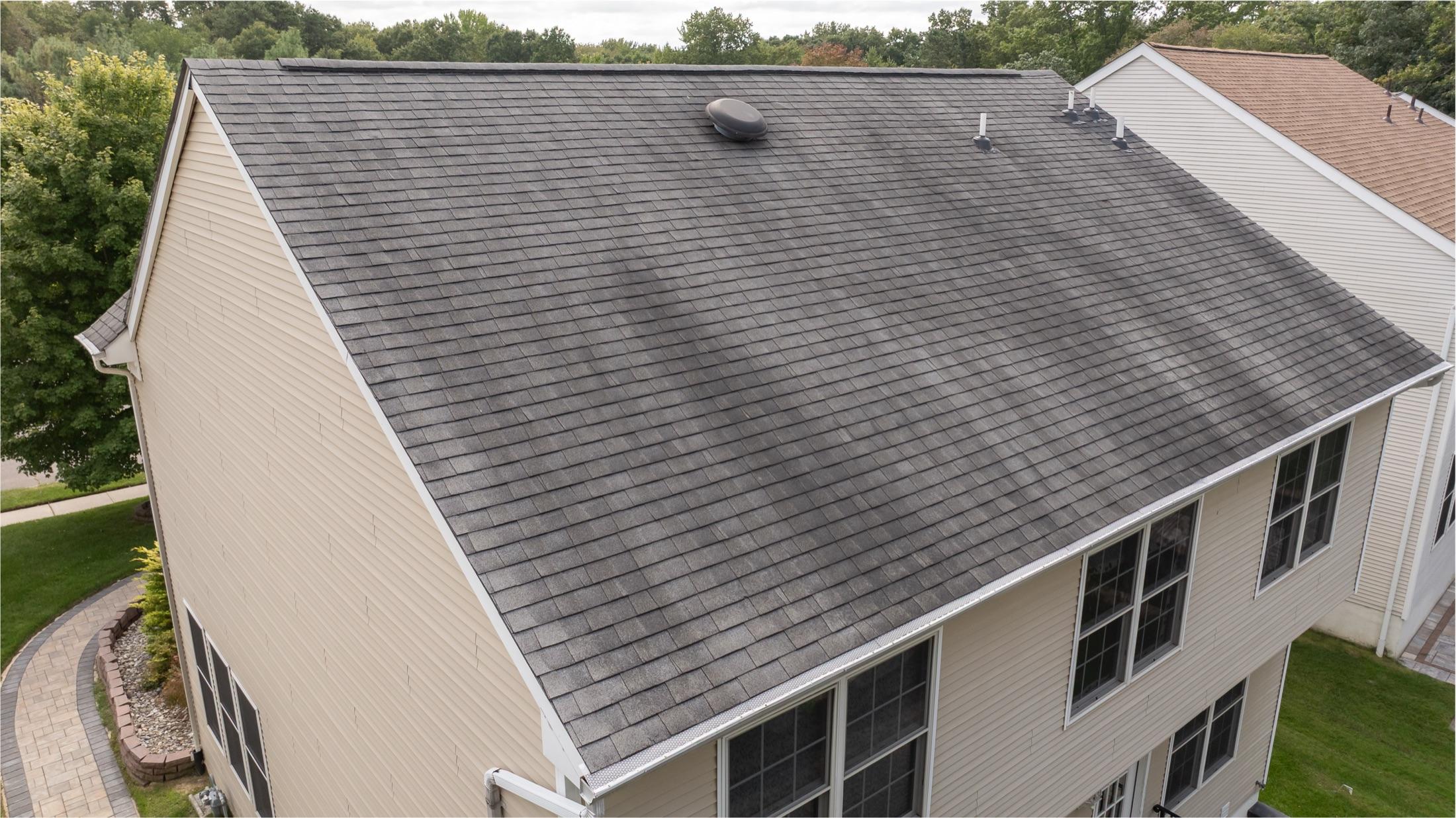 Aerial view of a full rear roof slope with vents and siding