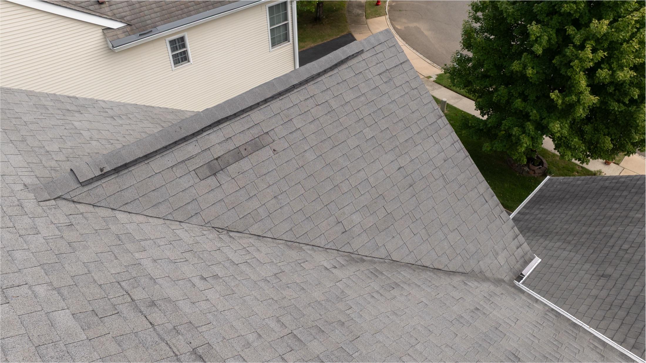 Aerial close-up of a roof valley and flashing after repair