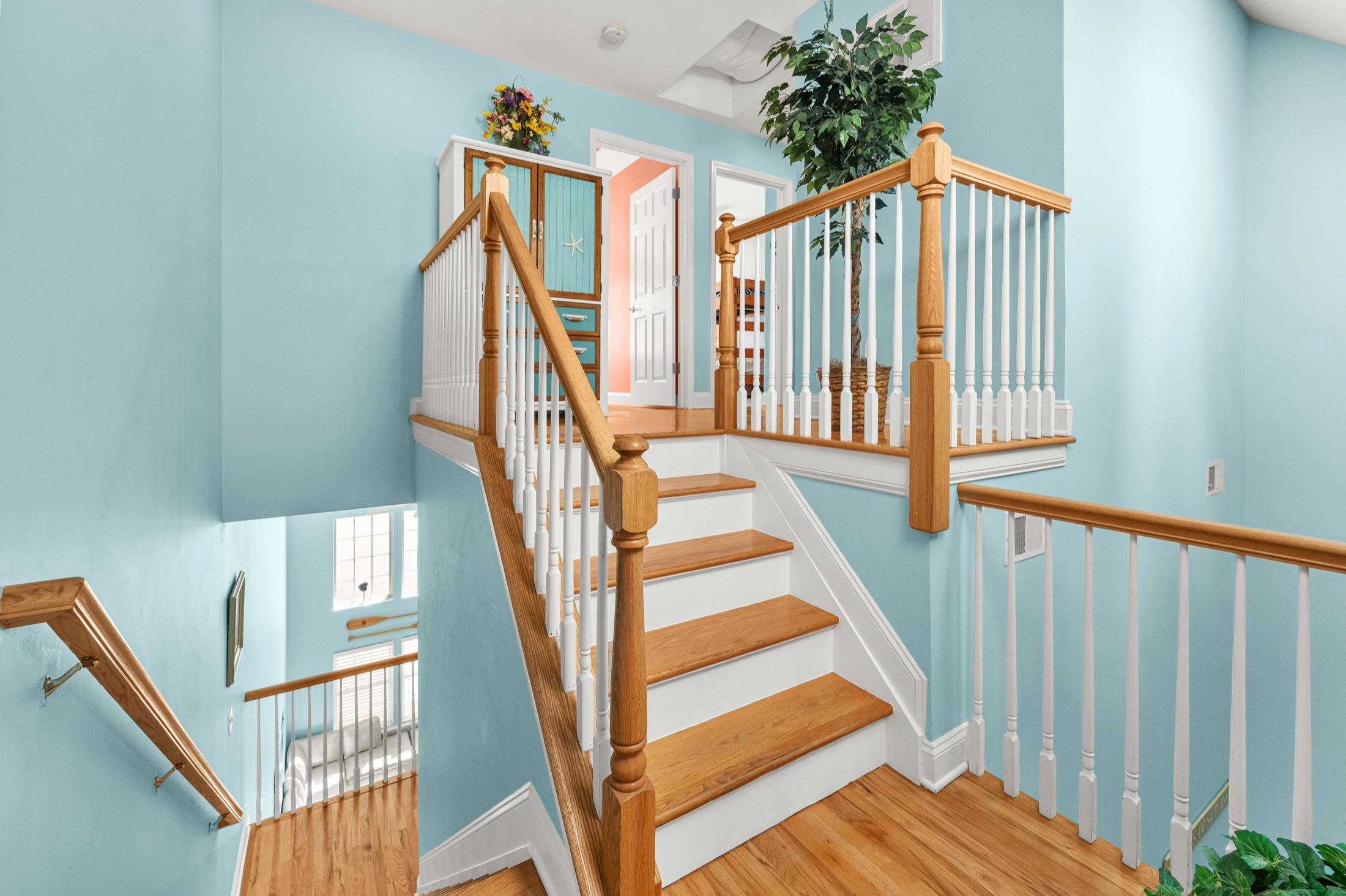 Open staircase connecting the floors of a Seaside Heights rental