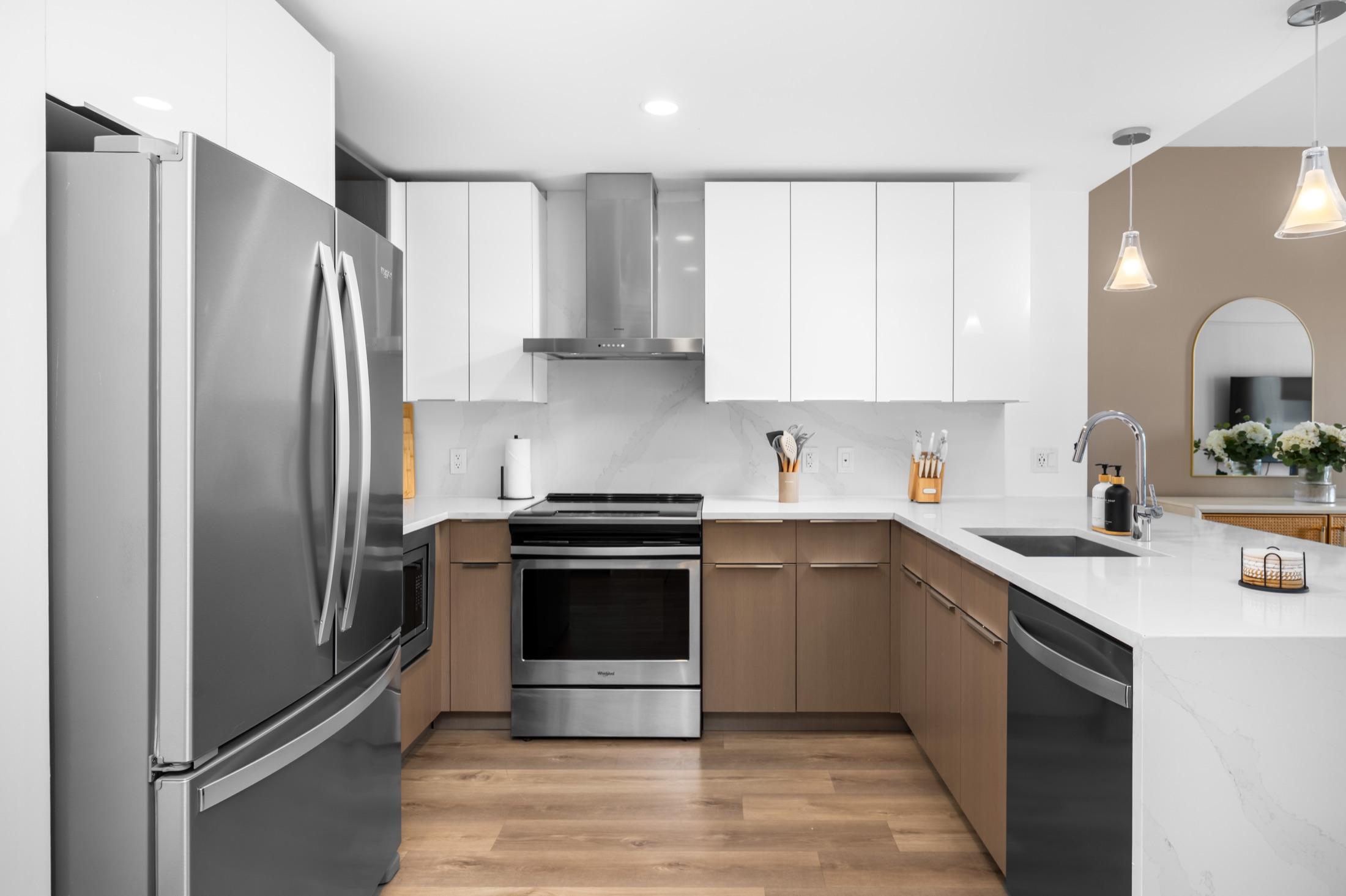 Modern kitchen with stainless appliances and a range hood, Hamilton Cove NJ