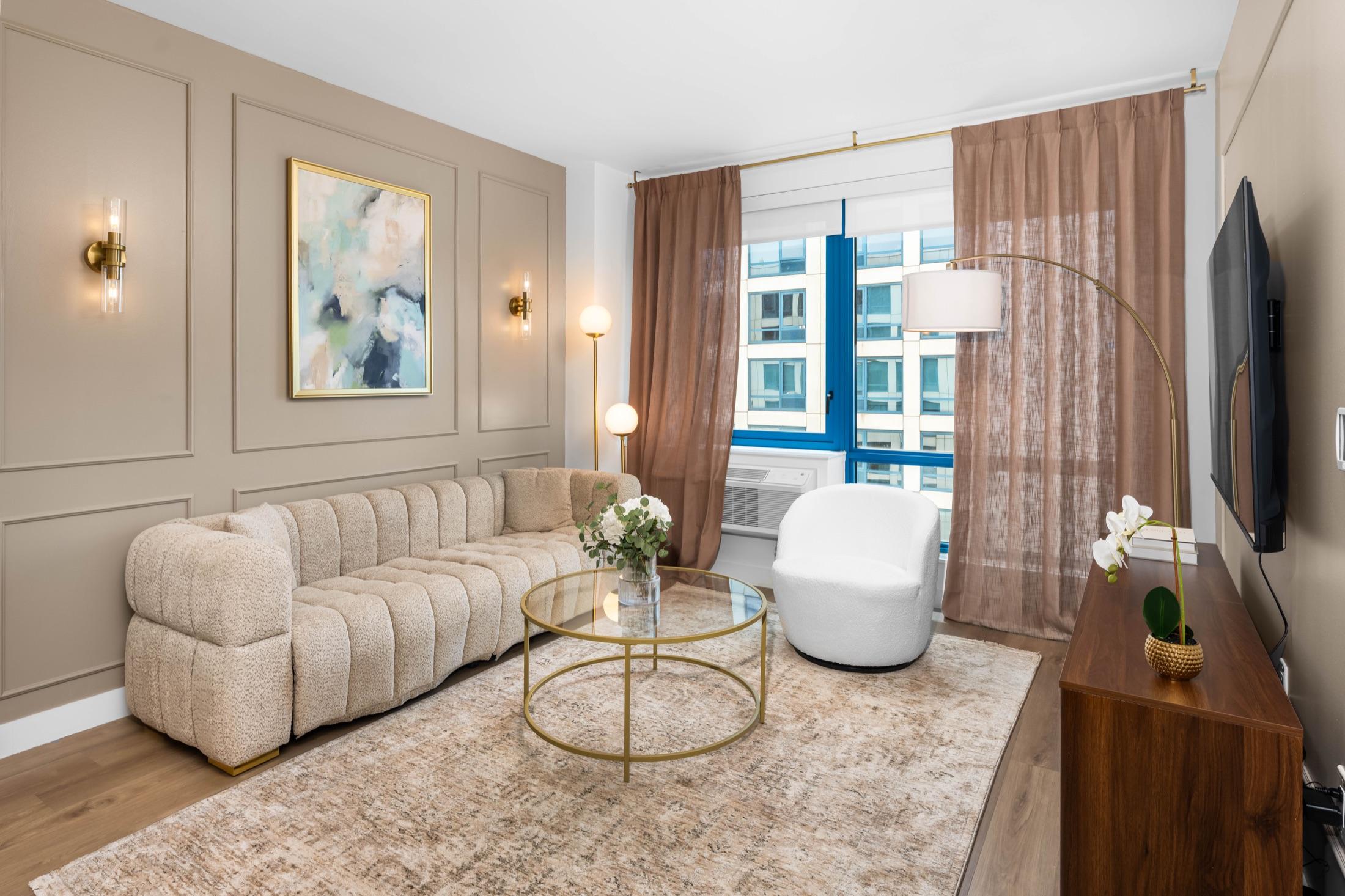 Furnished waterfront condo living room with warm flambient lighting, Hamilton Cove NJ