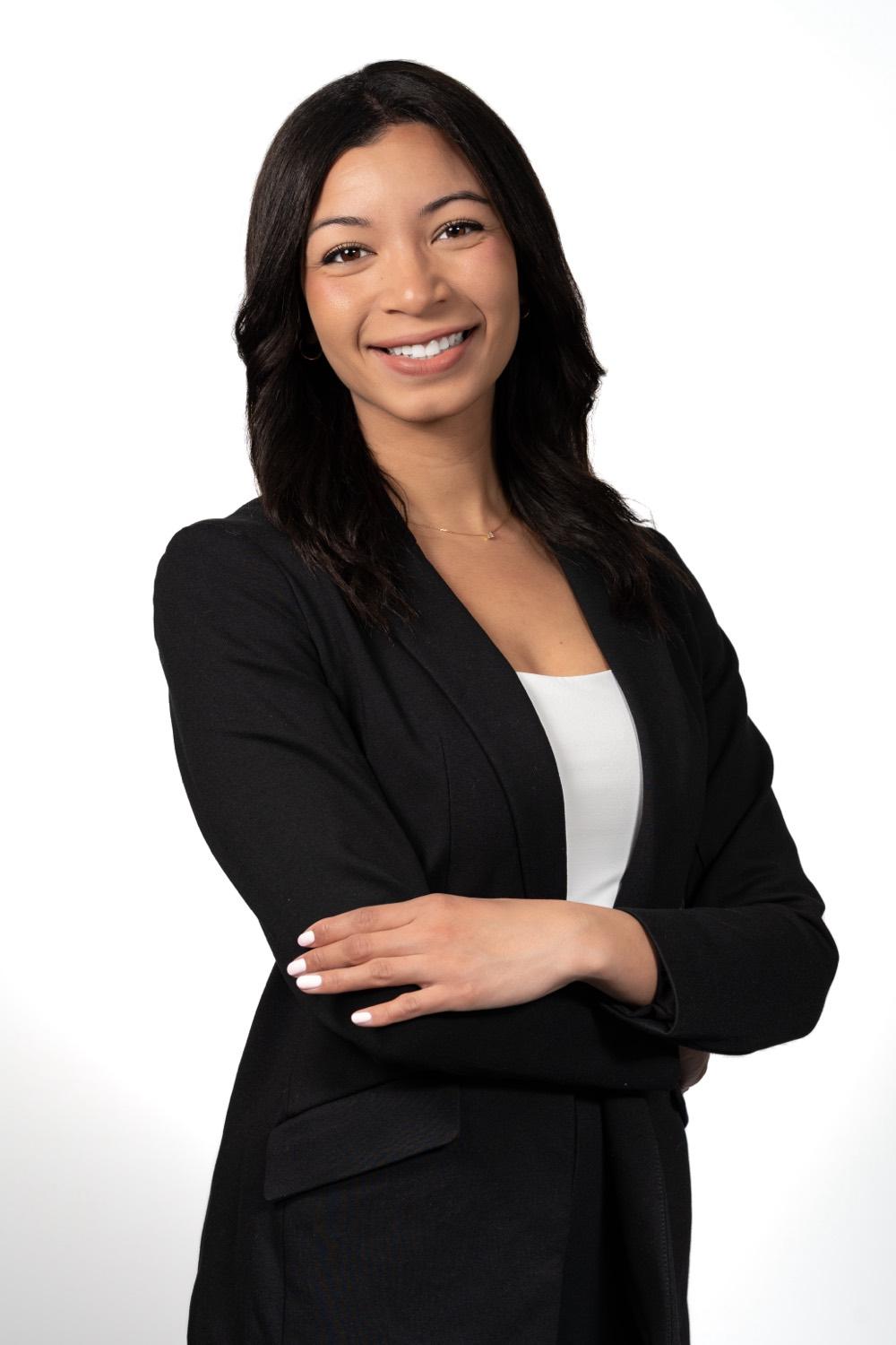 Corporate headshot of a woman in a black blazer