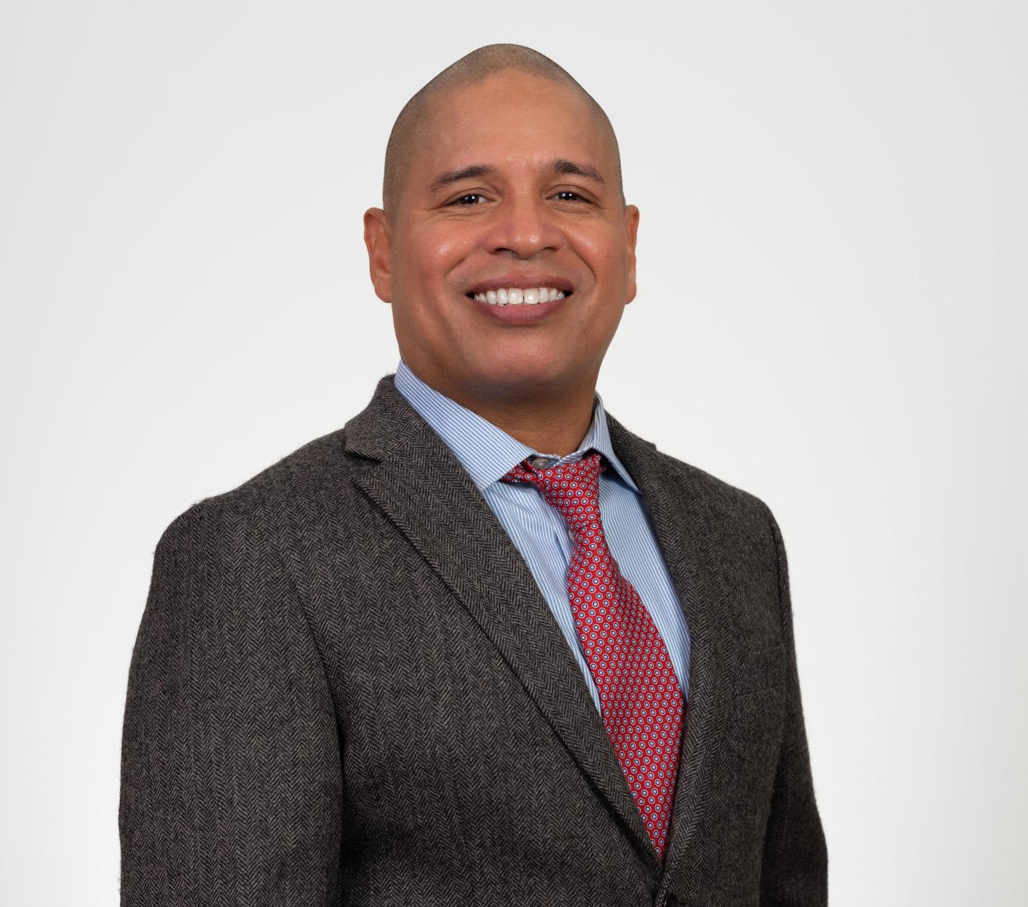 Professional corporate headshot of a man
