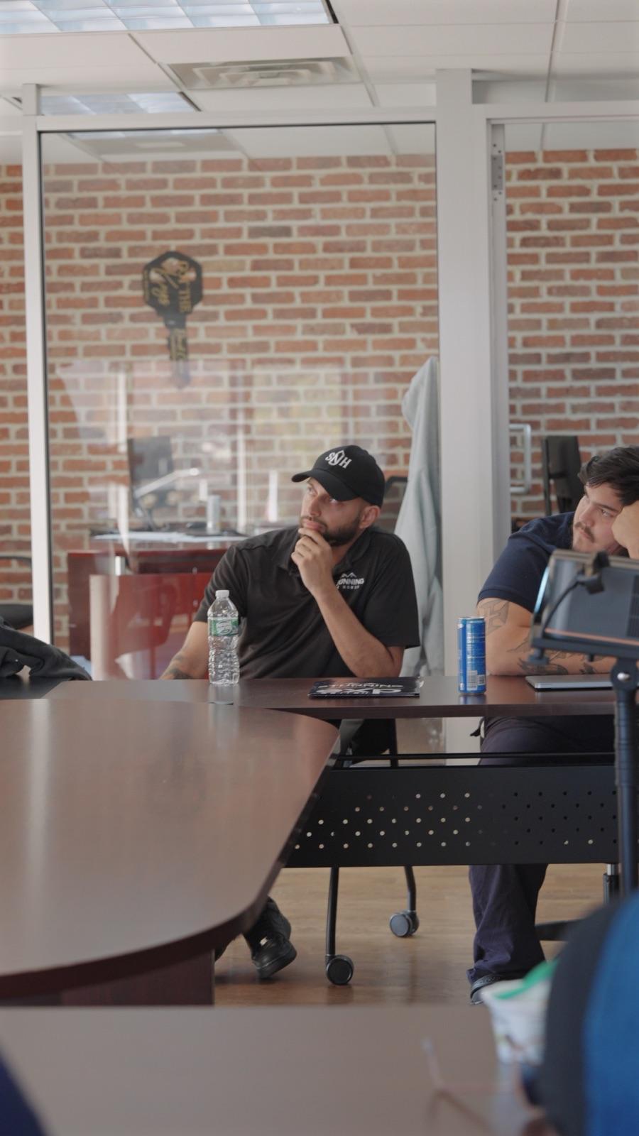 Candid frame of an agent during a filmed team meeting
