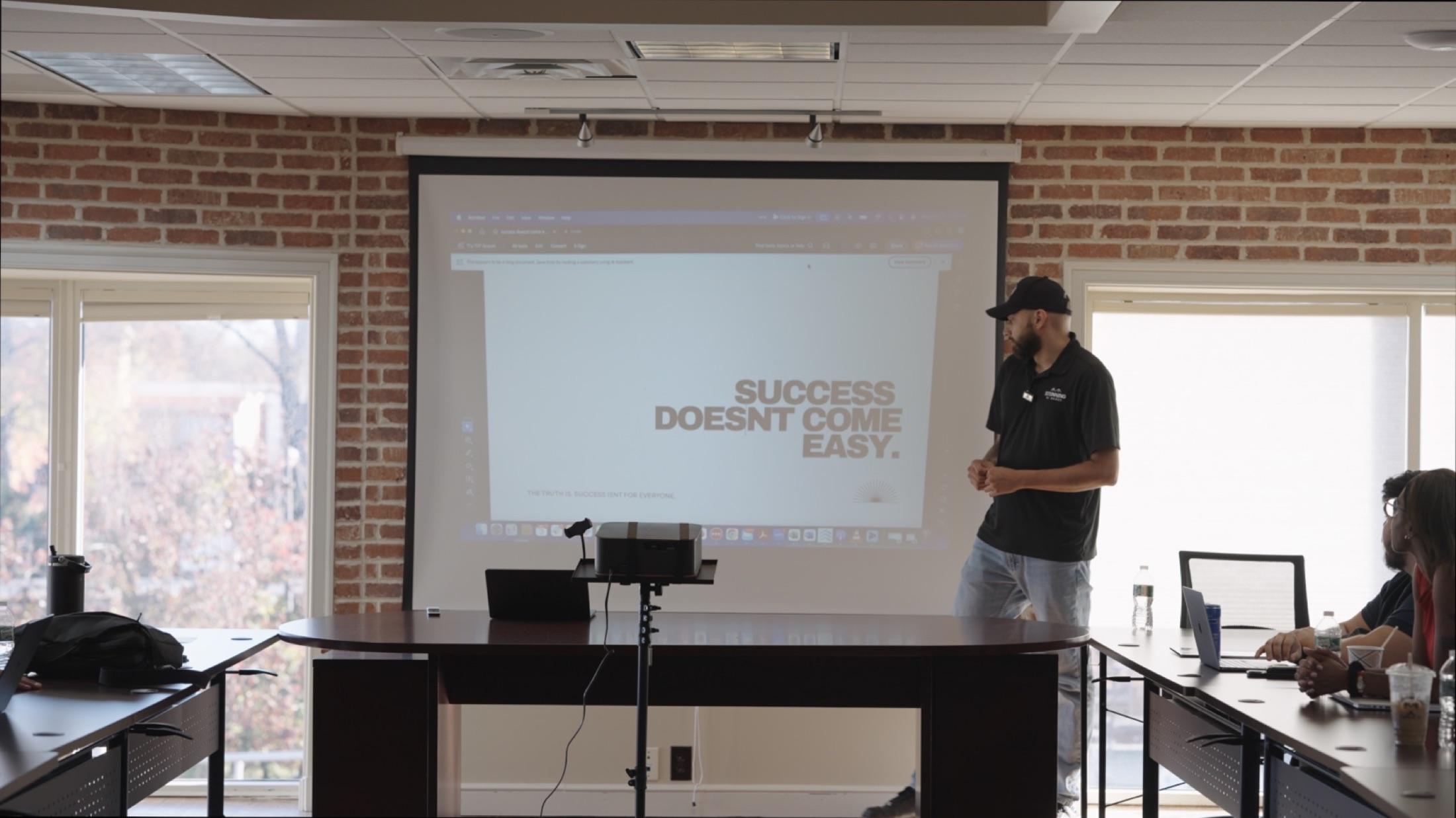 Team meeting filmed during an on-site content day at a NJ real estate office