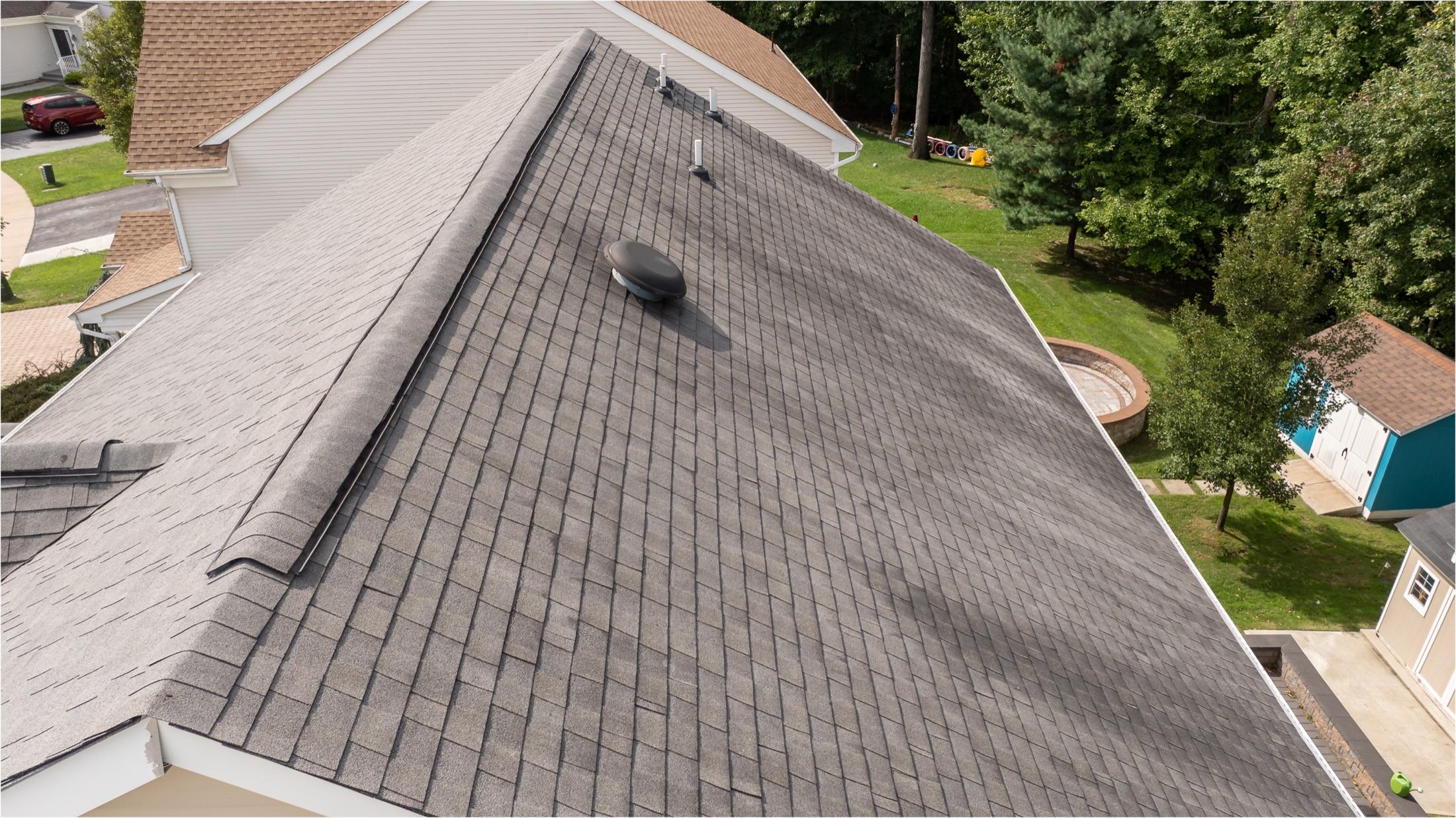 Aerial close-up of roof slope with vent and valley detail