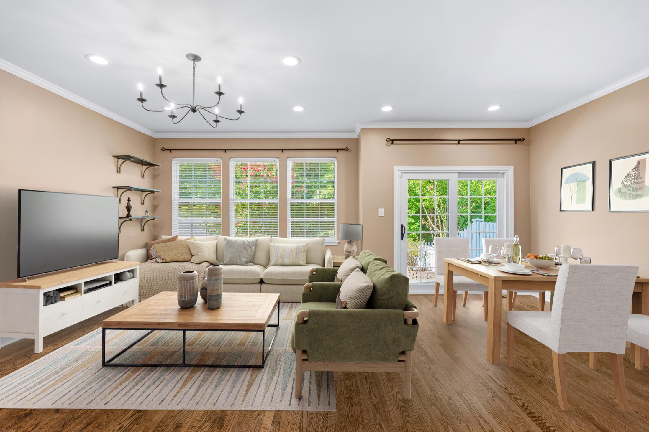 Virtually staged living and dining room with warm furnishings