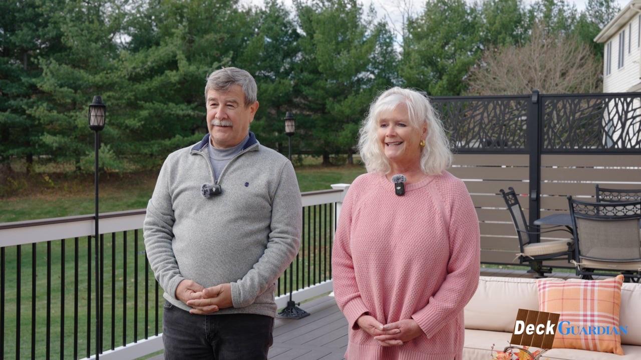 Homeowners giving an on-camera testimonial on their new deck